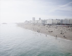 United Kingdom, England, Brighton, People resting at urban beach