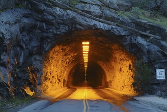 USA, Illuminated tunnel in mountains