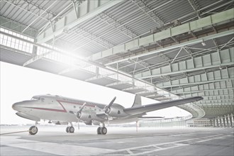 Germany, Berlin, Small airplane in hangar at Tempelhof Airport