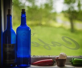 United Kingdom, England, Blue bottles on window sill