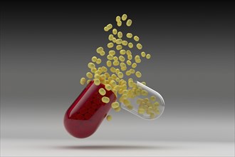 Studio shot of capsule with yellow pills inside