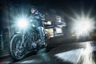 United Kingdom, London, Motorcyclists on street at night