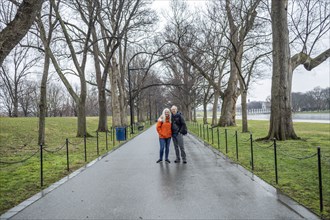 USA, Washington D.C., Senior couple posing for photo in park