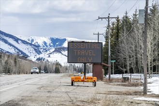 USA, Idaho, Sun Valley, COVID_19 lockdown on travel electronic sign on roadside
