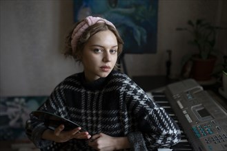 Portrait of mid adult woman at home