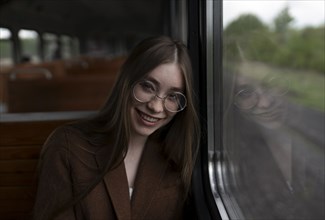 Russia, Omsk, Portrait of young woman in train