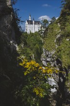 Germany, Schwangau, Scenic canyon with Neuschwanstein castle in autumn