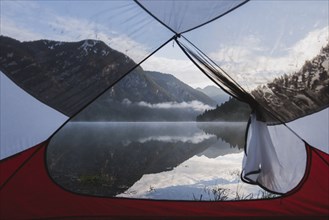 Austria, Plansee, Lake Plansee seen from tent in morning