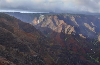 USA, Hawaii, Kauai, Na Pali, Aerial view of mountain range with waterfall