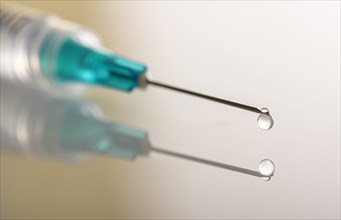 Liquid drop on top of syringe needle
