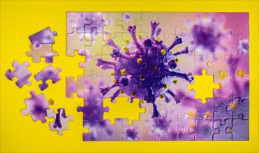 Studio shot of puzzle with Coronavirus model