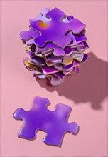 Stack of purple jigsaw puzzles