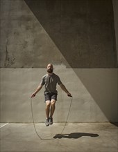 Man exercising with jumping rope
