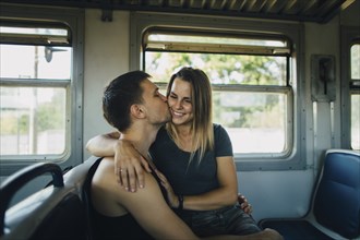 Romantic couple on train