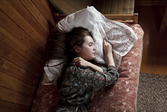 Young woman sleeping at home