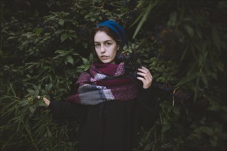 Ukraine, Crimea, Portrait of young woman wearing beret and scarf