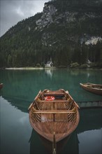 Italy, Wooden boat moored at Pragser Wildsee in Dolomites,