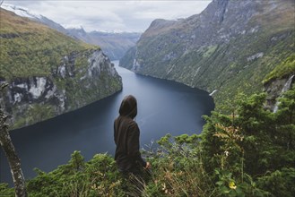 Norway, Geiranger, Man looking at scenic view of Geirangerfjord