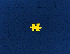 Yellow puzzle on blue background,,