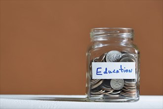 Coins in jar collected for education
