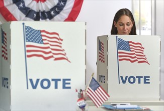 Woman voting in polling place