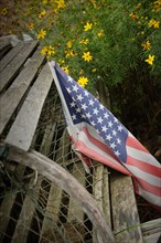 Faded American flag on old wood,,