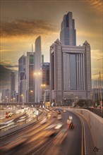 United Arab Emirates, Dubai, Traffic on highway and modern city architecture