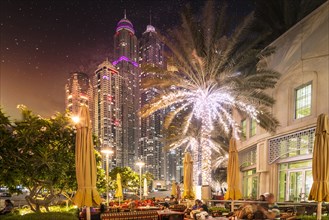 United Arab Emirates, Dubai, Illuminated skyscrapers at night