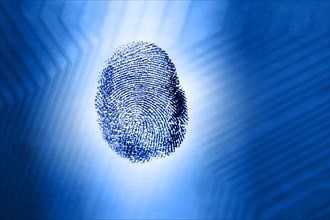 Fingerprint against blue circuit board pattern