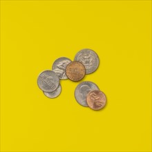 American coins on a yellow background