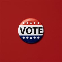Vote badge on red background