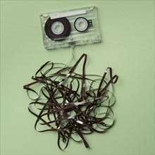 Analog audio cassette on green background