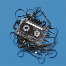 Analog audio cassette on blue background