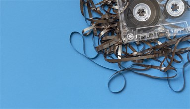 Analog audio cassette on blue background