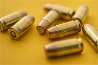 Brass bullets on yellow background