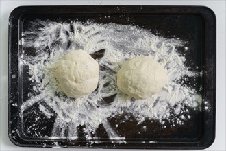 Raw dough on baking tray