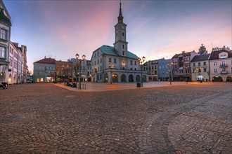 Poland, Silesia, Gliwice, Historic town square with town hall at dusk