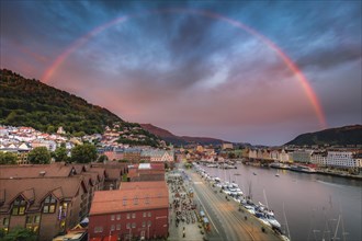 Norway, Western Norway, Bergen, Rainbow over city and fjords at sunset