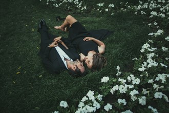Ukraine, Couple lying down on grass