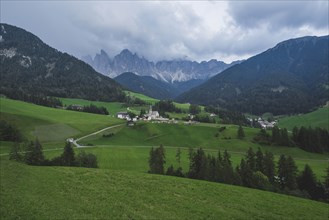 Italy, South Tyrol, Funes, Santa Magdalena, Landscape with village in valley