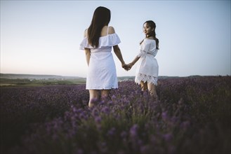 France, Women in white dress in lavender field