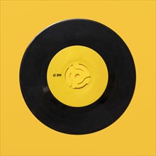 Vintage record on yellow background