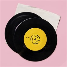 Vintage records on pink background