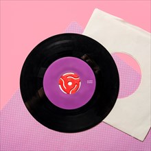 Vintage record on pink and purple background