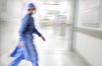 Doctor running in hospital