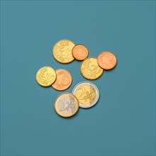 Euro coins on blue background