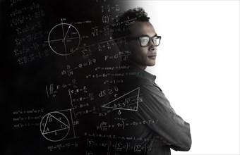 Studio shot of man with mathematical formulas
