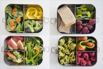 Lunch boxes with fresh vegetables and fruits