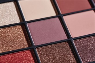Close up of palette of colorful eyeshadows