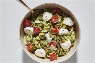 Pasta with Bocconcini and cherry tomatoes in bowl